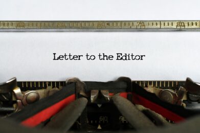 Letter to the Editor words typed on a sheet of paper in a vintage typewriter, concept
